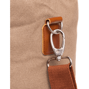 A close-up of a tan cooler bag featuring a metal clip and a brown strap. The bag has a textured fabric surface.