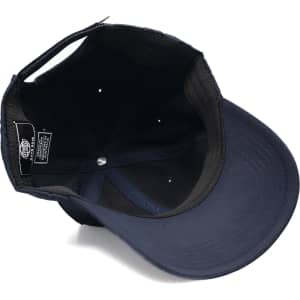 A navy cap with a structured brim and an interior lining, featuring branding inside.