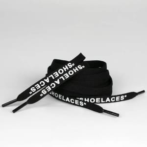 Black shoelaces with white lettering, featuring a logo, arranged in a loop on a neutral background.