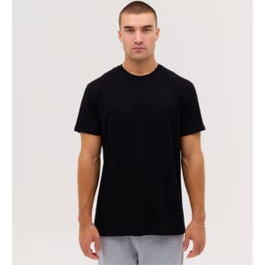 A black t-shirt for men, featuring a classic crew neck and short sleeves, displayed on a model against a neutral background.