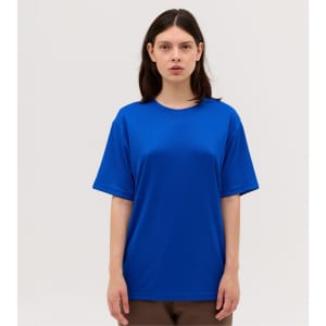 A blue t-shirt featuring short sleeves and a relaxed fit, with a logo on the front.