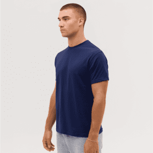 A navy blue T-shirt displayed on a model, featuring a simple design and a round neckline.