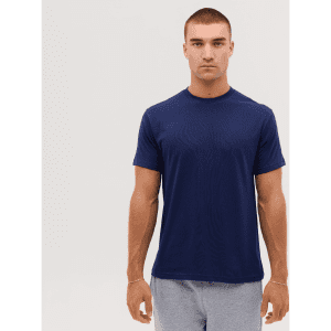 A navy blue T-shirt displayed on a male model, featuring short sleeves and a round neckline. It has a logo.