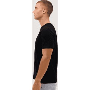 A classic black tee displayed on a model from the side, featuring short sleeves and a simple design.