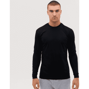 A long sleeve tee in black, featuring a fitted design and a logo, worn by a model against a plain background.