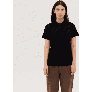 A black women's polo shirt with a collar, featuring short sleeves and a simple design. It includes a logo.