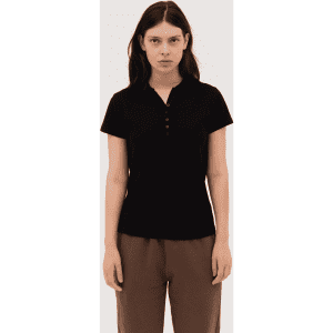 A women's black polo shirt with a button placket and short sleeves, featuring a logo on the chest.