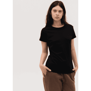 A black women's tee with a round neckline and short sleeves, modelled by a woman with long hair.