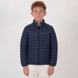 A navy puffer jacket with a zip closure and ribbed texture, designed for youth, worn by a model.