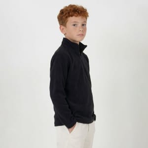 A youth-sized black polar fleece 1/4 zip top on a model, featuring a stand collar and a relaxed fit.