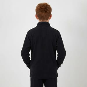 A child wearing a black polar fleece 1/4 zip top, viewed from the back with hands in pockets.
