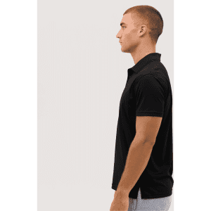 A black polo shirt displayed on a model from the side, featuring a subtle logo on the chest.