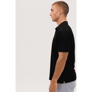 A black polo shirt displayed on a model, featuring a collar and short sleeves, with a logo on the chest.