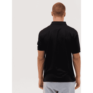 A black polo shirt is displayed from the back, featuring a collar and short sleeves. It has a logo on the upper back.