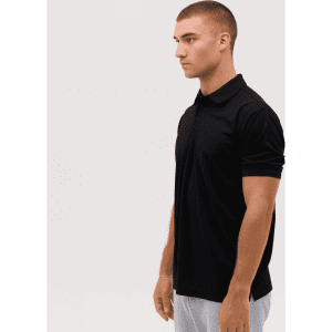A black polo shirt with a collar, shown on a model from the side. The shirt features a logo.
