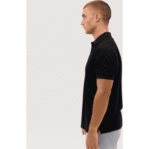 A black polo shirt displayed on a male model, showing a side profile view. The shirt features a logo.