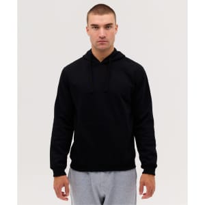 A black hooded sweatshirt featuring a front pouch pocket and drawstrings, worn by a model.
