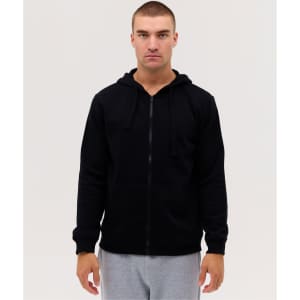 A black zip-up hooded sweatshirt with long sleeves, displayed on a model wearing grey pants.