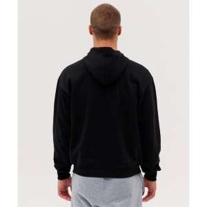 A black zip hoodie with a hood, viewed from the back, paired with light grey pants. It features a logo.