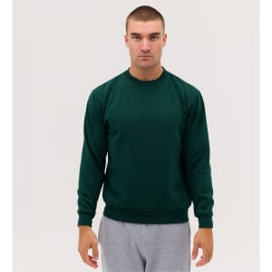 A green crewneck sweatshirt worn by a model, featuring long sleeves and a classic fit, against a plain background.
