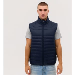 A navy puffer vest with a zip, featuring a high collar and horizontal stitching, worn over a grey t-shirt.