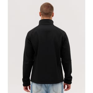 A black Prime Softshell Jacket is displayed from the back, featuring a high collar and a fitted design.