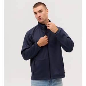 A navy Summit Bonded Jacket on a model, featuring a high collar and zip closure. The jacket has pockets and a logo.