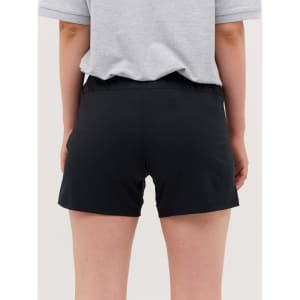 Black running shorts are displayed on a person, viewed from the back, with a grey t-shirt partially visible.