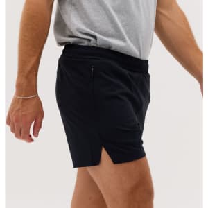 Running shorts in black, featuring a side split and an elastic waistband. Includes a small pocket and a logo.