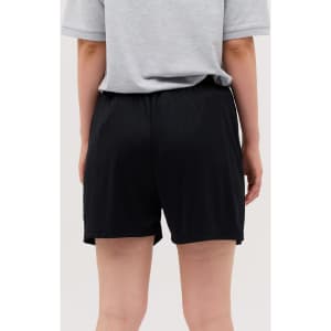 Black shorts showcased on a model from a rear view, featuring an elastic waistband and a smooth fabric texture.