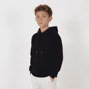 A black youth hoodie with a front pocket, featuring a hood and drawstrings, worn by a young boy.