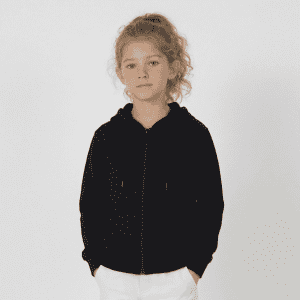 A black zip hoodie for youth featuring a front zip and two pockets, styled casually with a hood.