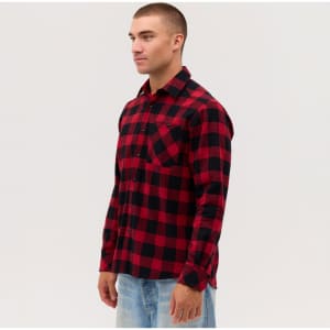 A long sleeve flannel shirt in red and black check pattern, featuring a front pocket and a logo.