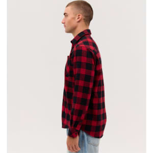 A long sleeve flannel shirt featuring a red and black check pattern, with a single chest pocket and a logo.