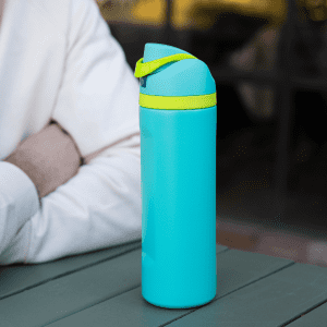 A drink bottle in bright teal with a yellow lid and strap, featuring a branding logo on the side.