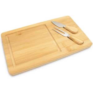 A bamboo cheese board with a carving section and two stainless steel cheese knives featuring wooden handles.