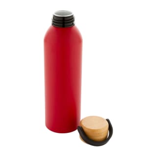 A drink bottle in vibrant red aluminium with a black screw-on lid and a wooden drink top.