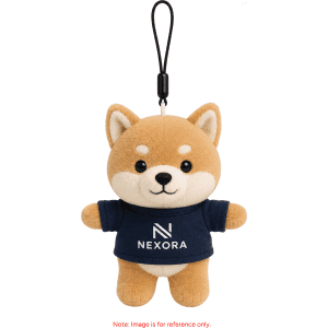 A plush keyring of a cute dog, featuring a brown and cream colour scheme, with a branded shirt.