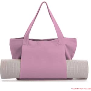 A pink canvas bag with long handles, displaying a rolled yoga mat in a neutral colour. The bag features a logo.