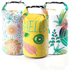 Three colourful waterproof dry bags in yellow, white, and a patterned design, featuring floral and tropical motifs.