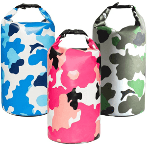 Three waterproof dry bags in vibrant colours: blue-and-white camo, pink-and-white camo, and green-and-black camo, each with a logo.