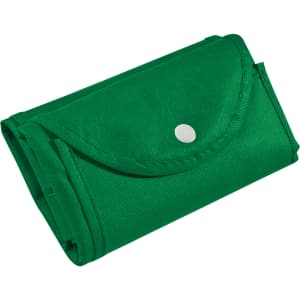 A green foldable non-woven shopping bag, neatly folded and secured with a snap button, featuring a logo.