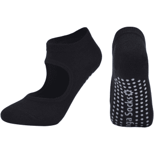 A pair of black yoga socks featuring an open top design and dotted grip on the soles. They have a logo.