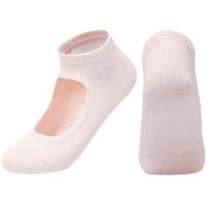 A pair of light pink yoga socks featuring an open top design and a snug fit. Brand logo is visible on the socks.