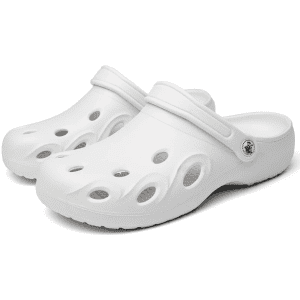 A pair of white clog slides with multiple ventilation holes and a side logo.