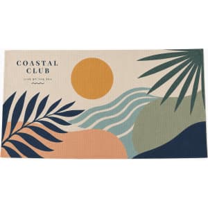 An orange and white sandless beach towel, featuring a textured pattern and a logo.