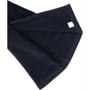 A dark navy cotton golf towel with a folded corner and a small logo.