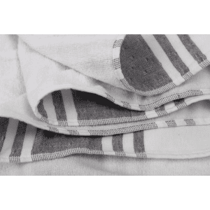 A foldable beach towel bag in white with grey stripes and circular designs, featuring a logo.
