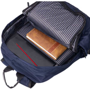 A navy backpack opens to reveal a striped interior, featuring a laptop, notebook, and a leather-bound journal.