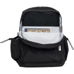A black backpack opened to reveal storage space, including a compartment for a notebook. The interior is grey and includes a logo.